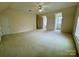 Spacious carpeted bonus room with a ceiling fan, window dormers, and plenty of natural light at 6316 Glengarrie Ln, Huntersville, NC 28078