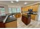 Spacious kitchen featuring granite countertops, stainless steel appliances, and a central island at 6316 Glengarrie Ln, Huntersville, NC 28078
