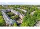 Aerial view of townhomes surrounded by lush trees and green grass at 656 Garden District Dr, Charlotte, NC 28202