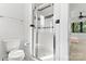 Modern bathroom featuring a glass-enclosed shower with white tile and sleek fixtures at 656 Garden District Dr, Charlotte, NC 28202