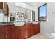 Elegant bathroom with dual sinks, wood cabinets, and modern fixtures at 656 Garden District Dr, Charlotte, NC 28202