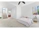 Bright bedroom with neutral carpet, a ceiling fan and large windows at 656 Garden District Dr, Charlotte, NC 28202