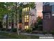 Charming townhome featuring a brick facade, manicured landscaping, and large windows at 656 Garden District Dr, Charlotte, NC 28202