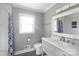 Bathroom featuring a modern vanity, toilet, and a shower with white tile and patterned curtain at 6701 Highbrook Dr, Charlotte, NC 28212
