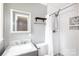 Updated bathroom featuring a tiled shower, modern vanity, and decorative mirror at 6701 Highbrook Dr, Charlotte, NC 28212