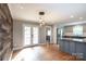 Open concept eat-in kitchen features stainless steel appliances and access to the outdoor living space at 6701 Highbrook Dr, Charlotte, NC 28212