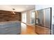 Open kitchen area with stainless steel refrigerator, granite countertops, and access to outdoor space at 6701 Highbrook Dr, Charlotte, NC 28212