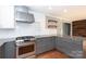 Updated kitchen featuring stainless steel appliances, white subway tile backsplash, and granite countertops at 6701 Highbrook Dr, Charlotte, NC 28212