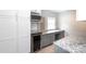 Kitchenette with custom cabinets, wine cooler, stainless microwave, and granite counters at 6701 Highbrook Dr, Charlotte, NC 28212