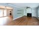 Spacious living room featuring built-in bookcases, fireplace and open layout for entertaining at 6701 Highbrook Dr, Charlotte, NC 28212