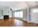Bright living room with hardwood floors, fireplace and built-in shelving on either side at 6701 Highbrook Dr, Charlotte, NC 28212