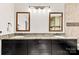 Bathroom boasts double sinks, granite counters, and decorative mirrors for a modern, upscale feel at 7181 Windy Ridge Dr, Iron Station, NC 28080