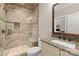 Well-lit bathroom with granite countertop vanity and walk-in shower with glass enclosure and stone bench at 7181 Windy Ridge Dr, Iron Station, NC 28080