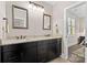 Bathroom features granite counters, double vanity, and decorative mirrors creating a spa-like retreat at 7181 Windy Ridge Dr, Iron Station, NC 28080