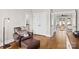 Sitting area in a bedroom, a reading chair and view of a doorway into the bathroom and living area at 7181 Windy Ridge Dr, Iron Station, NC 28080