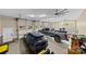 Spacious three car garage featuring an electric car and large truck at 7181 Windy Ridge Dr, Iron Station, NC 28080