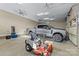 Spacious two car garage featuring a large truck and a riding lawn mower at 7181 Windy Ridge Dr, Iron Station, NC 28080