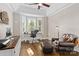 Home office with dark hard wood floors, a large bay window, and a comfortable leather chair at 7181 Windy Ridge Dr, Iron Station, NC 28080