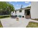 Outdoor patio with dining set, lounge seating, and backyard views at 7200 Monroe Rd, Charlotte, NC 28212