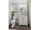 Well-lit bathroom features a vanity, toilet, shower with stylish gray tile floors at 7200 Monroe Rd, Charlotte, NC 28212