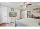 Inviting bedroom showcases a ceiling fan, TV, and neutral decor with hardwood floors at 7200 Monroe Rd, Charlotte, NC 28212