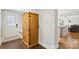Entryway showcases wooden cabinet and view of an open-concept kitchen and living space at 7200 Monroe Rd, Charlotte, NC 28212