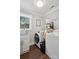 Functional laundry room features modern appliances, a utility sink, and ample storage space at 7200 Monroe Rd, Charlotte, NC 28212