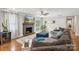 Cozy living room with a fireplace, comfortable seating, hardwood floors, and a view of the backyard at 7200 Monroe Rd, Charlotte, NC 28212