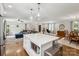 Open-concept living space with a kitchen island, a dining area, and a comfortable living room at 7200 Monroe Rd, Charlotte, NC 28212