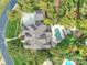Beautiful aerial of estate with a pool, mature trees, and a large yard at 7311 Barrington Ridge Dr, Fort Mill, SC 29707
