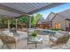 Lush backyard oasis featuring a pool, outdoor seating, mature trees, and elegant landscaping at 7311 Barrington Ridge Dr, Fort Mill, SC 29707