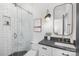 Modern bathroom with subway tile shower, glass door, stylish mirror, and granite countertop sink at 7311 Barrington Ridge Dr, Fort Mill, SC 29707