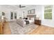 A spacious bedroom featuring a king size bed, wood floors, and neutral decor at 7311 Barrington Ridge Dr, Fort Mill, SC 29707