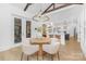 An open dining area featuring a modern table and chairs with clear sight-lines into the kitchen at 7311 Barrington Ridge Dr, Fort Mill, SC 29707