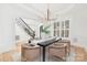Elegant dining room with a modern chandelier, wainscoting, and a stylish table setting for sophisticated dining at 7311 Barrington Ridge Dr, Fort Mill, SC 29707