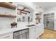 Close-up view of kitchen with stainless steel appliances and a granite countertop with decorative features at 7311 Barrington Ridge Dr, Fort Mill, SC 29707