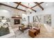Inviting living room with a stone fireplace, wood floors, comfortable seating, and stylish decor, creating a warm atmosphere at 7311 Barrington Ridge Dr, Fort Mill, SC 29707
