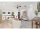 This is a bright sitting area with cozy seating, neutral decor, and hardwood floors at 7311 Barrington Ridge Dr, Fort Mill, SC 29707