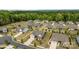 Expansive aerial view of a well-planned neighborhood with craftsman style homes, trees, and manicured lawns at 8018 Green Heron Ct, Belmont, NC 28012