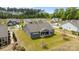 Aerial view showcasing the large backyard, covered patio, and well-maintained landscaping with neighborhood view at 8018 Green Heron Ct, Belmont, NC 28012