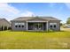 Large green backyard featuring a covered patio at 8018 Green Heron Ct, Belmont, NC 28012