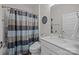 Bathroom featuring neutral walls, shower with curtain, toilet, and sink at 8018 Green Heron Ct, Belmont, NC 28012