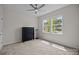 Neutral bedroom with a window and a black dresser at 8018 Green Heron Ct, Belmont, NC 28012