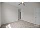 Neutral bedroom with a ceiling fan and a view of a doorway to another room at 8018 Green Heron Ct, Belmont, NC 28012