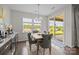 Comfortable dining area near sliding door offering backyard view at 8018 Green Heron Ct, Belmont, NC 28012