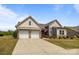 Stunning home with a spacious driveway, two-car garage, and beautiful landscaping creating curb appeal at 8018 Green Heron Ct, Belmont, NC 28012