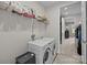 Bright laundry room with a washer and dryer and wire shelving at 8018 Green Heron Ct, Belmont, NC 28012