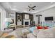 Open living room with modern decor, fireplace, hardwood floors, and a view to other rooms at 8018 Green Heron Ct, Belmont, NC 28012
