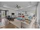 Open-concept living area with modern furnishings, hardwood floors, and a view into the kitchen at 8018 Green Heron Ct, Belmont, NC 28012