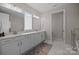 Main bathroom with double vanity, large mirrors, and plenty of counter space at 8018 Green Heron Ct, Belmont, NC 28012